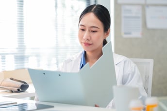 doctor holding medical file